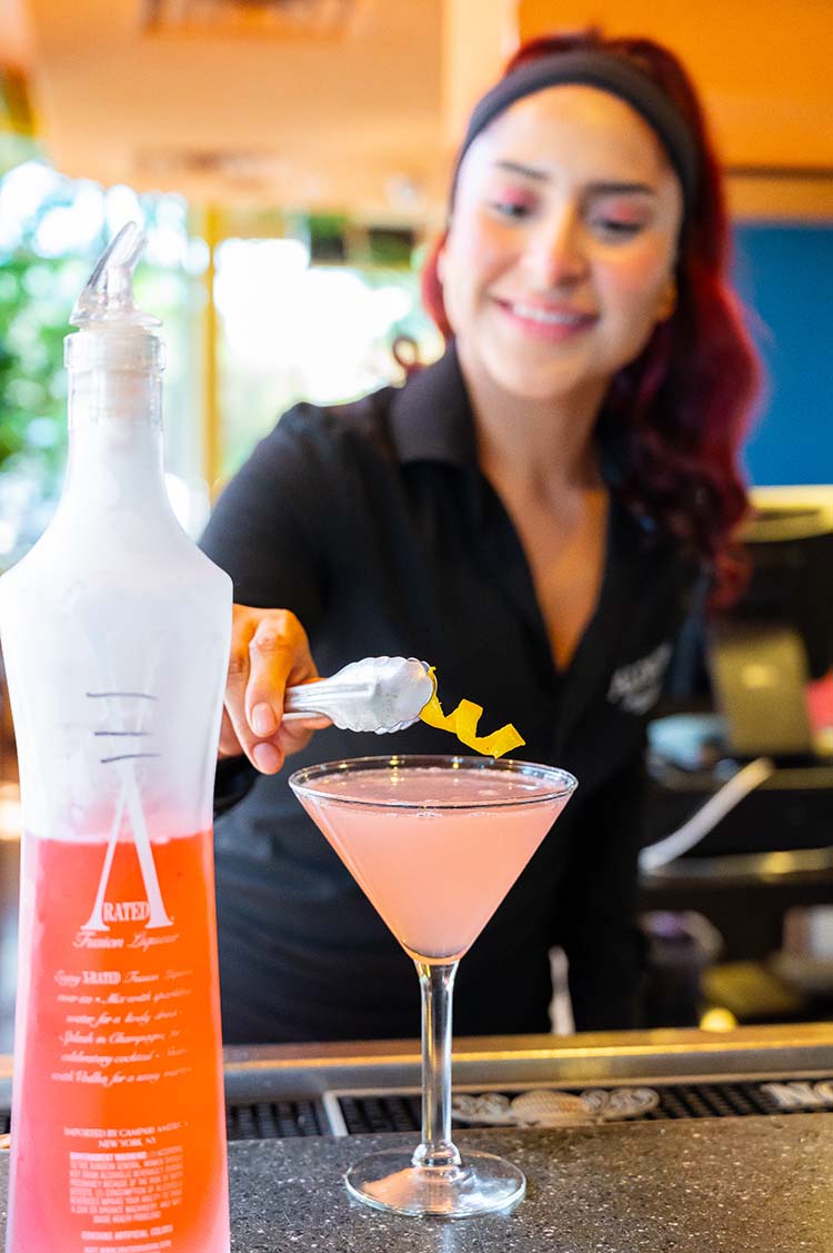 bartender at Aldacos serving drink