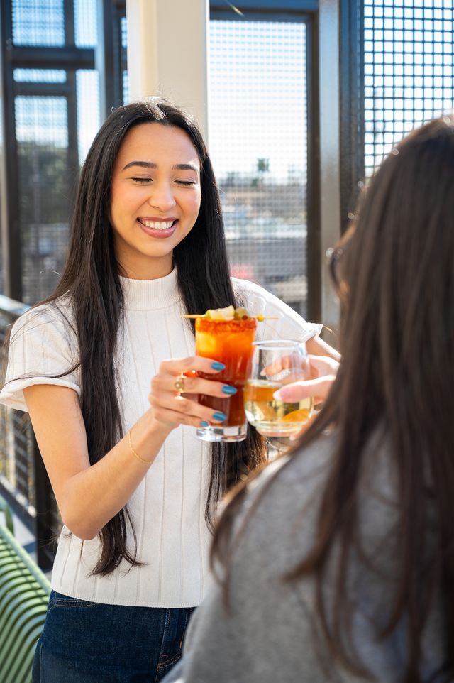 bartender serving a drink at Rosarios for social media marketing bartender serving a drink at Rosarios for social media marketing